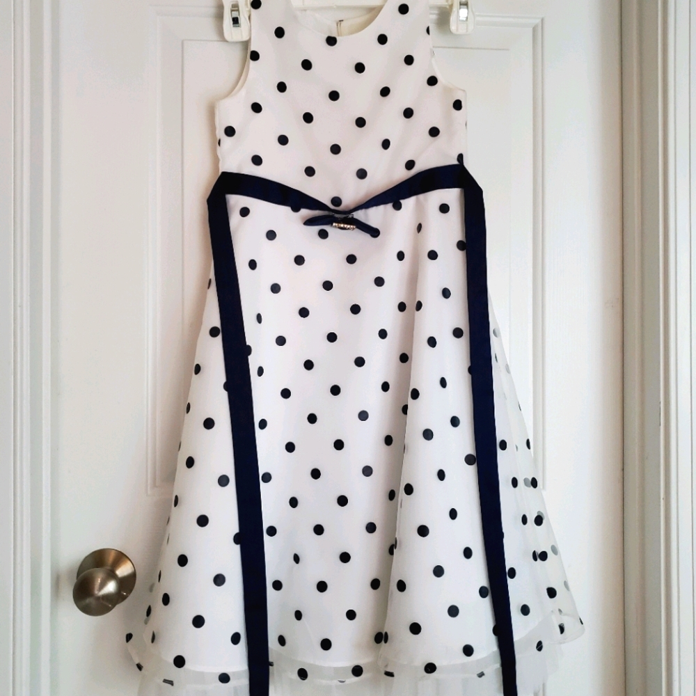 A white dress with blue polkadots.